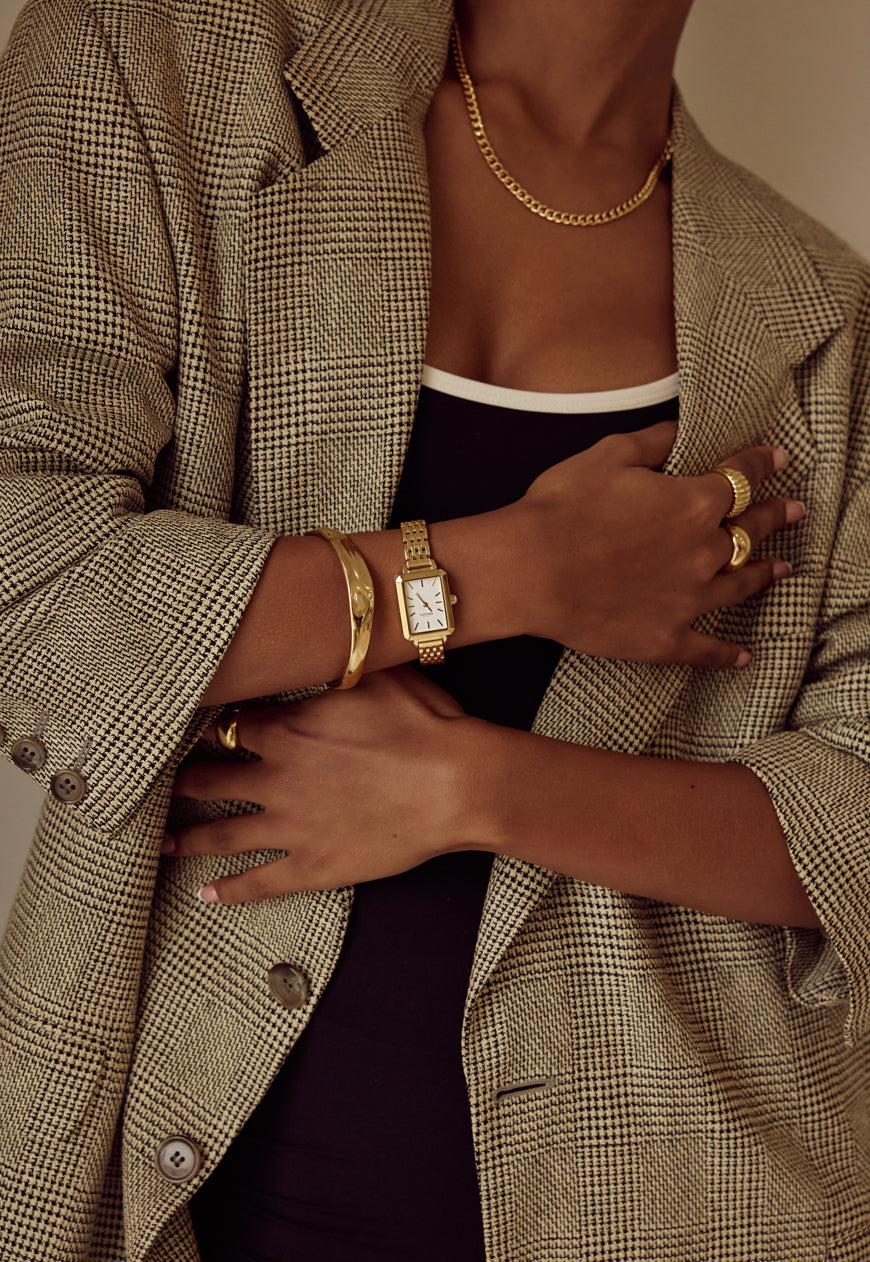 Close-up detail of the Cendré Demi gold bangle sculptural profile