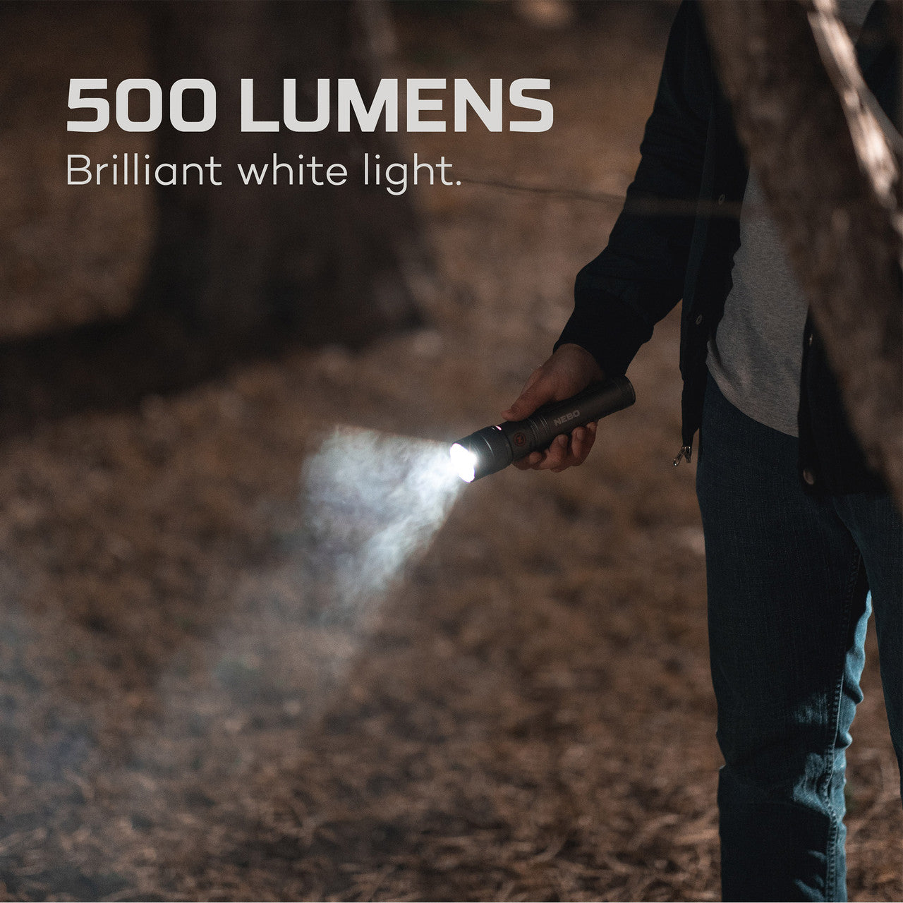 Handheld flashlight emitting a bright 500-lumen beam of white light.