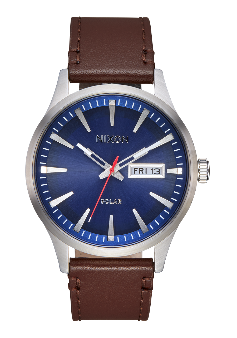 Wristwatch with a blue dial, silver case, and brown leather strap.
