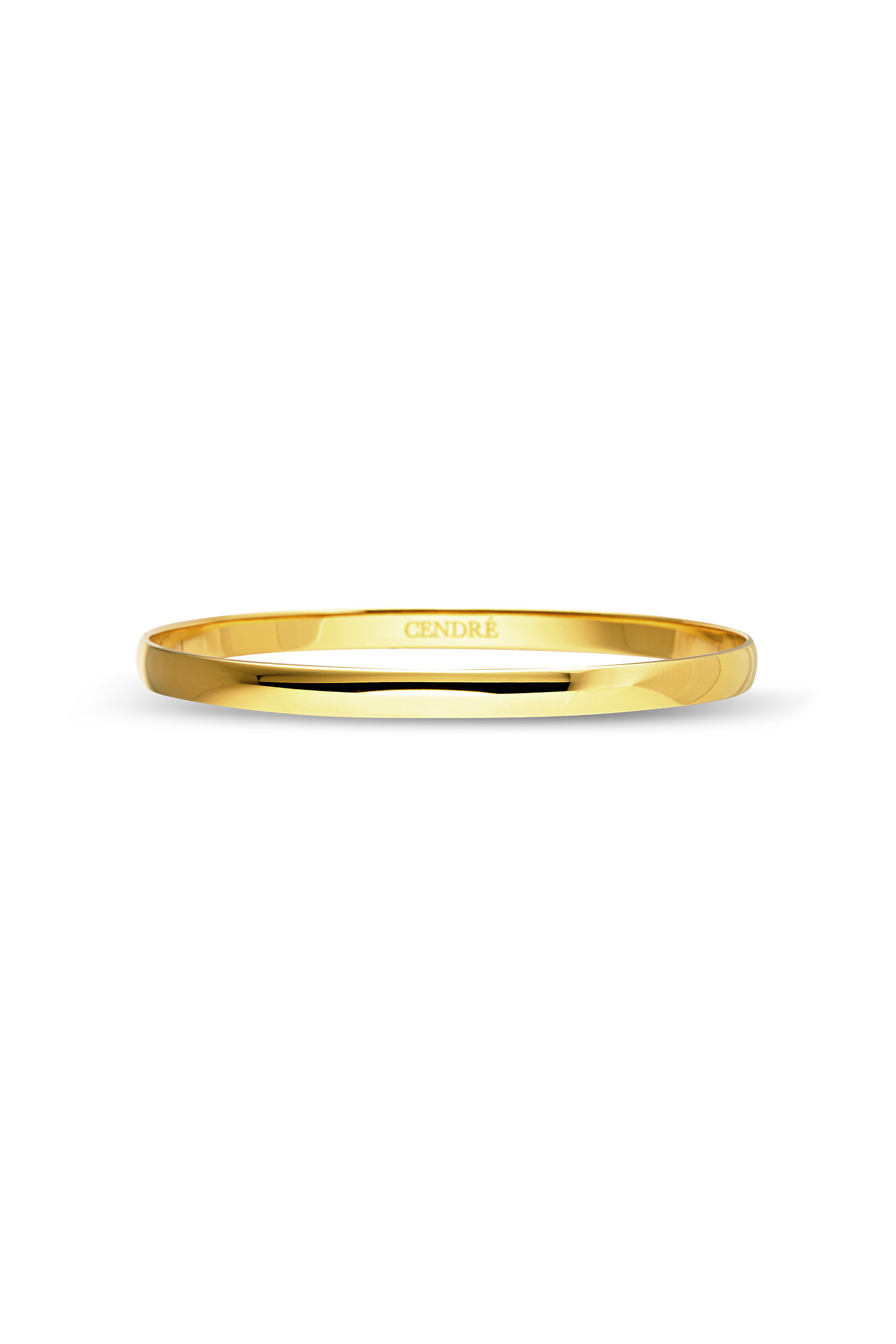 Cendré Presley gold bangle on a white background