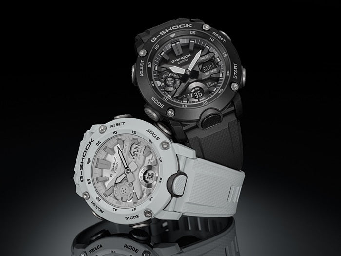 Two rugged sports watches with multiple dials and functions, one black and one white.