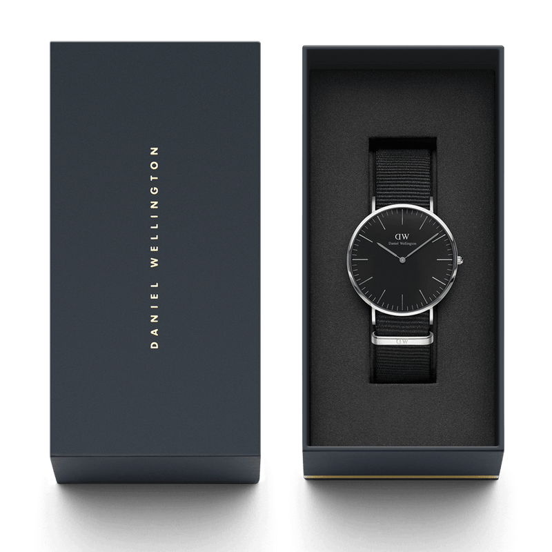 Sleek wristwatch with a black face and silver case in an elegant packaging box.