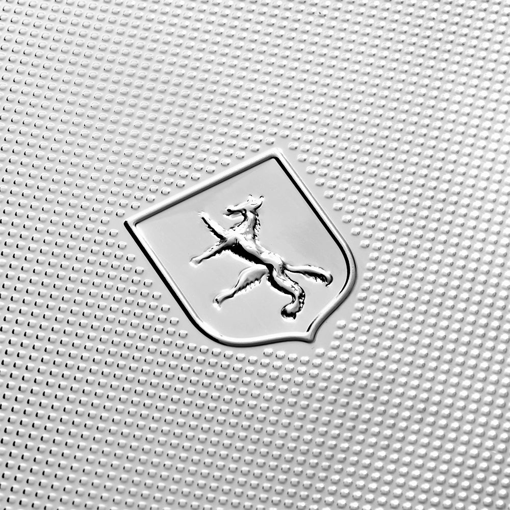 Wolf Silver Programmable Double Watch Winder 999 silver with engine-turned pattern and shield logo on textured panel.