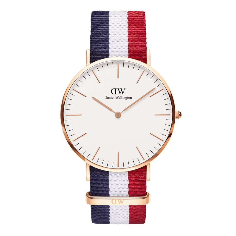 Wristwatch with a white face and tricolor fabric band in blue, white, and red.