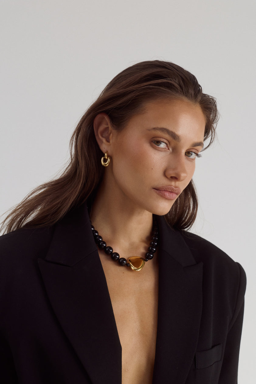 Cendré Plaza necklace styled with an outfit
