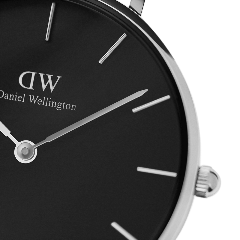 Sleek wristwatch with a black face and silver markings from Daniel Wellington.