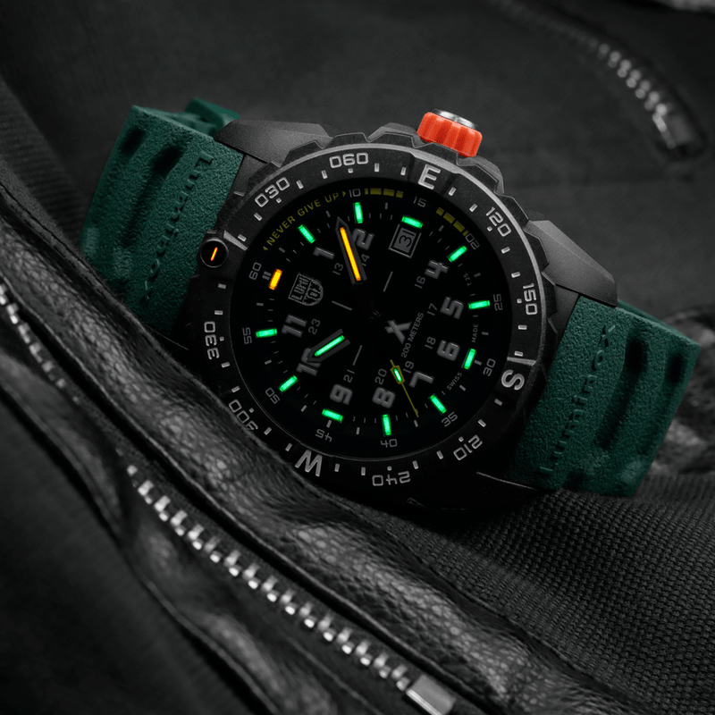 Stylish sports watch with a black face, green strap, and luminous markings.