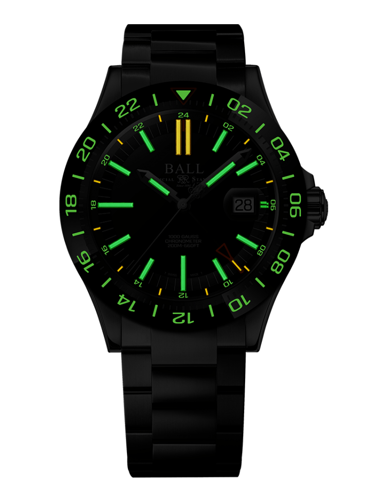 Black wristwatch with luminous green markings and a yellow hour hand on its dial.