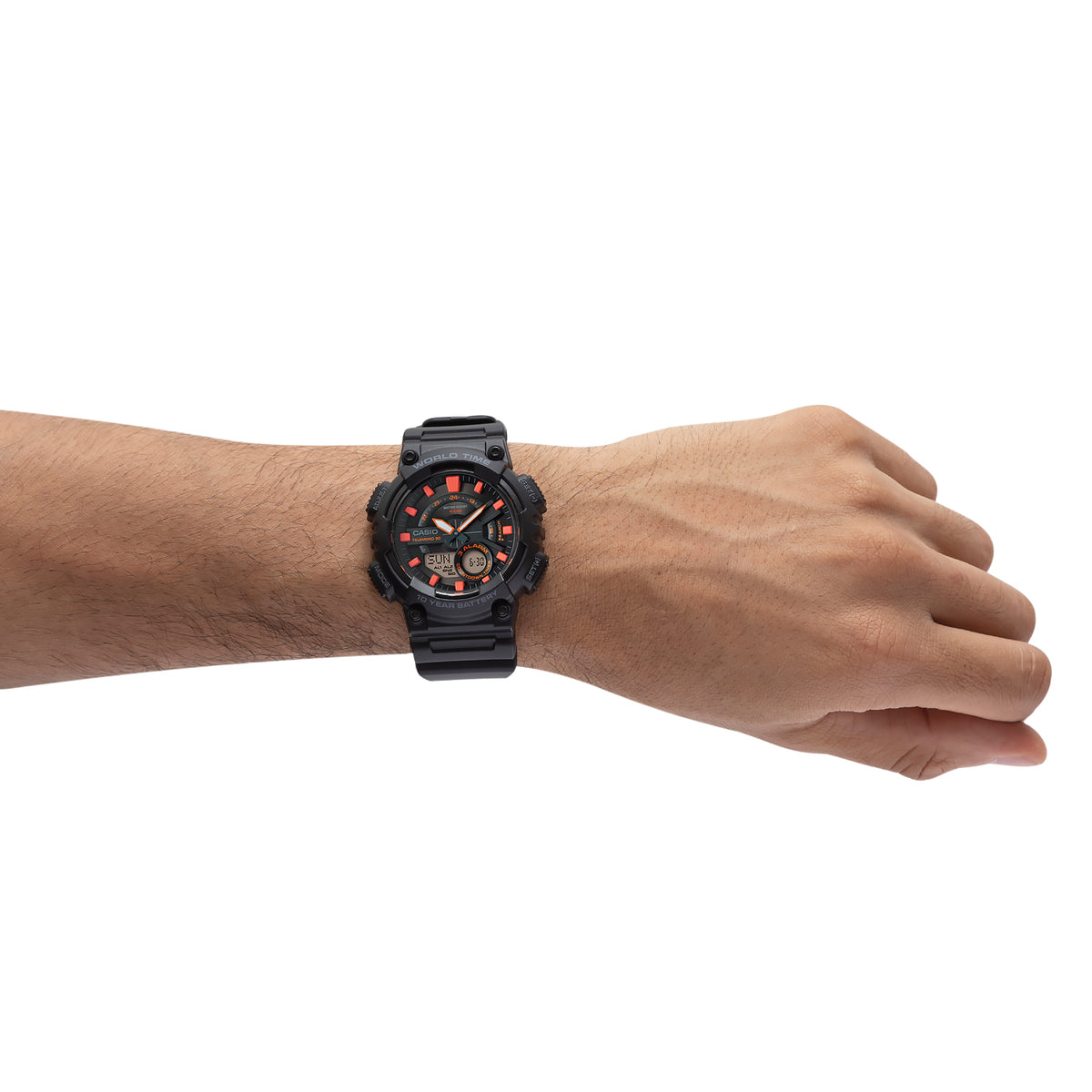Black sports watch with red accents worn on a wrist.