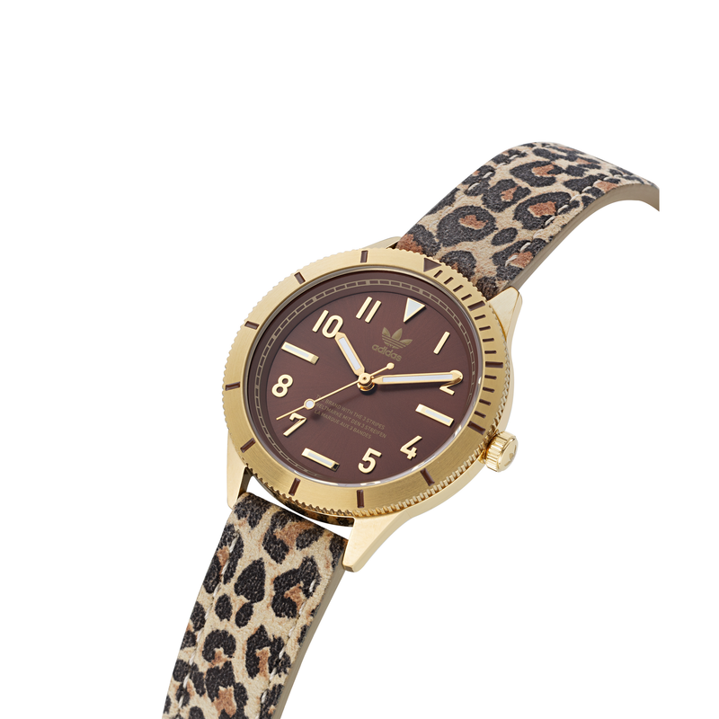 Wristwatch with a gold-tone case, brown dial, and leopard print strap.