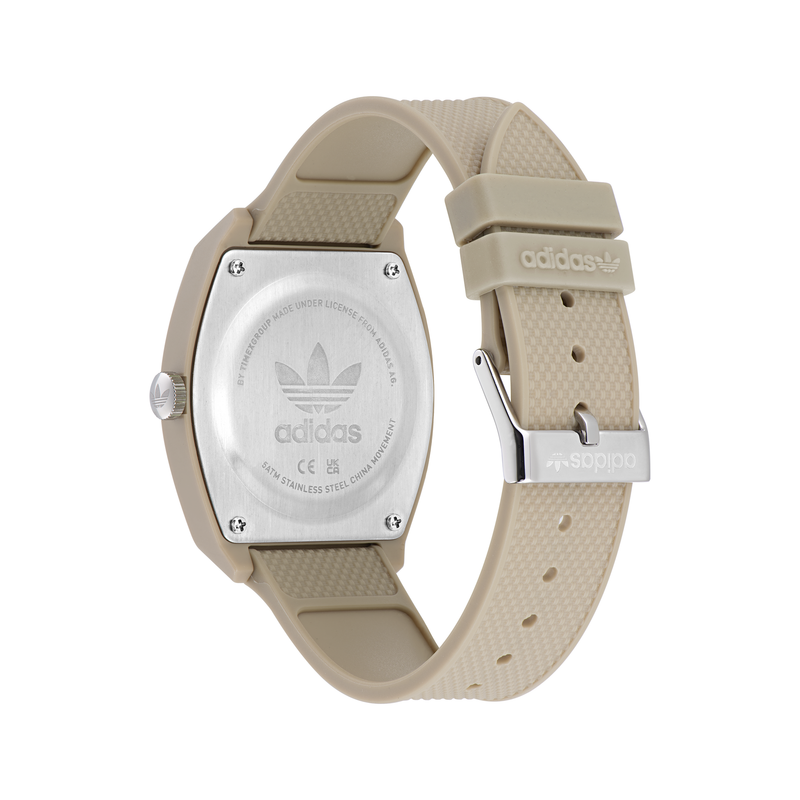 Beige wristwatch with an Adidas logo on the back.