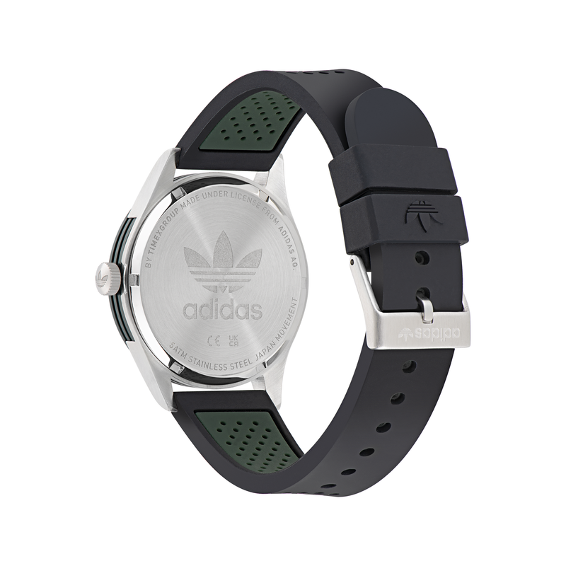 Adidas wristwatch with a black and green rubber strap and silver-toned case.