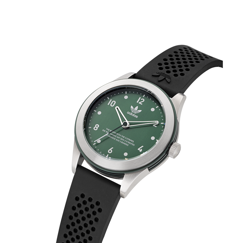 Wristwatch with a green dial and black perforated strap.