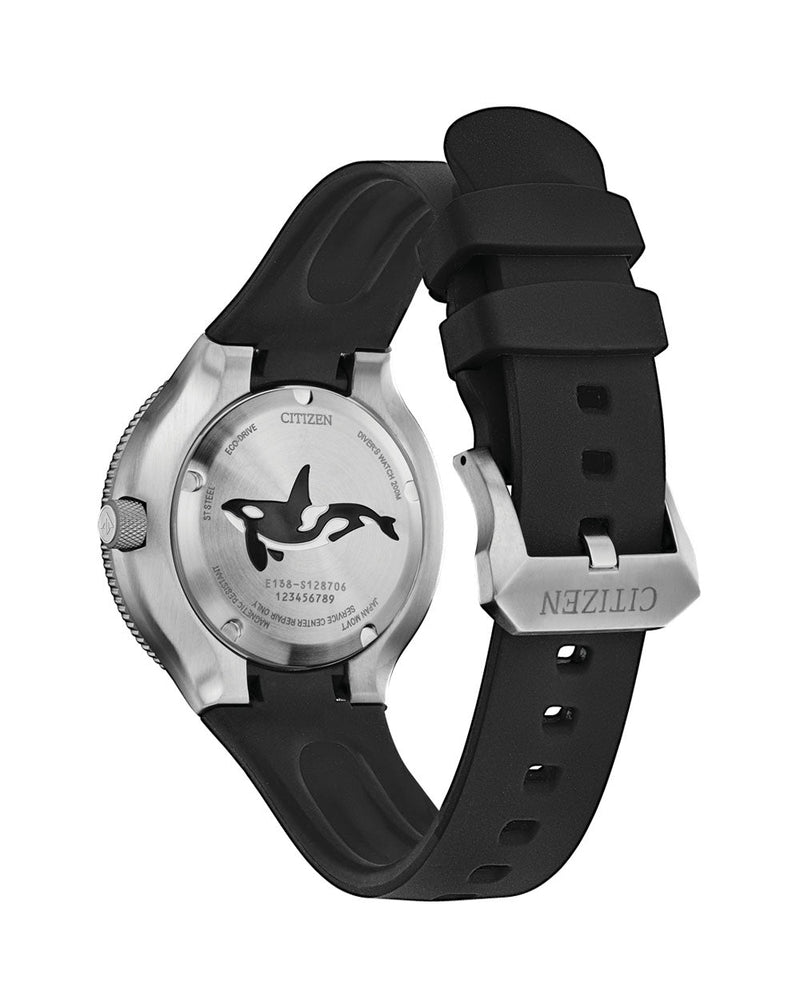 Wristwatch with a black rubber strap and a whale or orca design on its face.