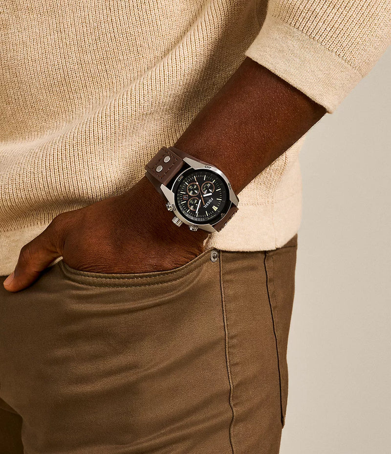 Stylish chronograph wristwatch with a dark face and metal case.