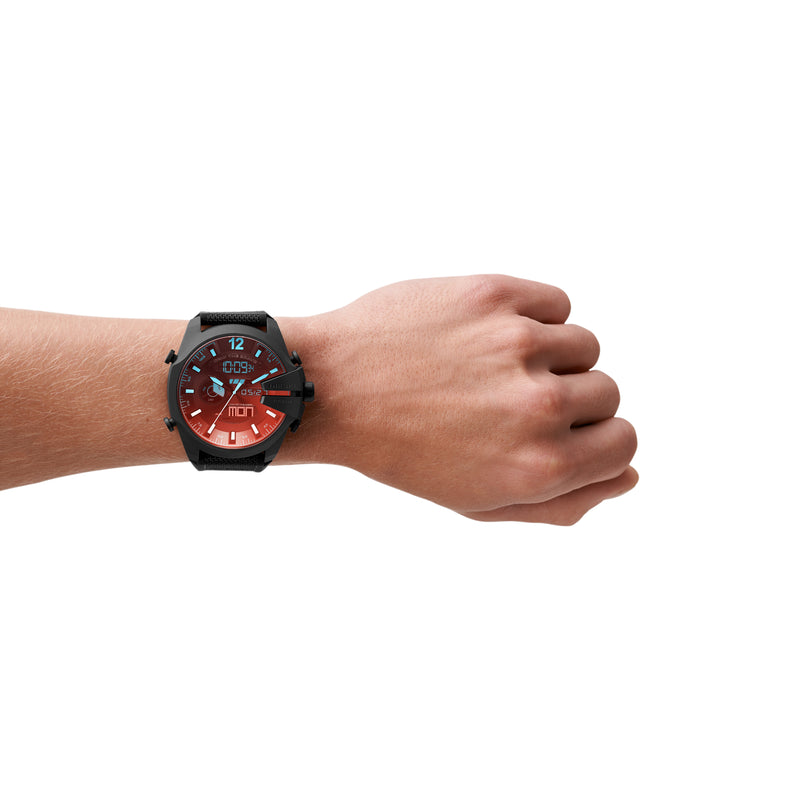 Wristwatch with a black case and red dial worn on a person’s wrist.