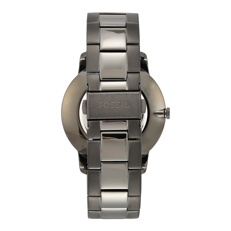 Metallic wristwatch with a chunky bracelet-style band and minimalist face design.