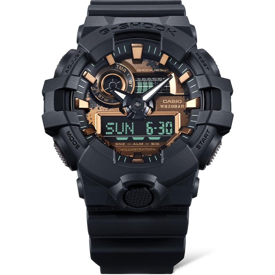 Rugged black G-Shock digital-analog wristwatch with gold accents on the dial.