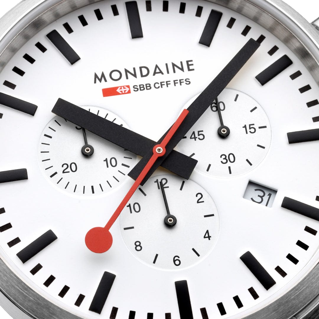 Analog watch face with the Mondaine brand name and multiple time-telling subdials.