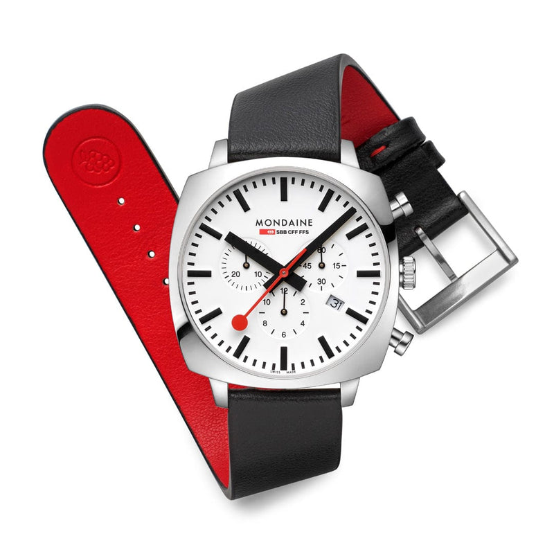 Mondaine wristwatch with a white dial, silver case, and interchangeable black and red leather straps.