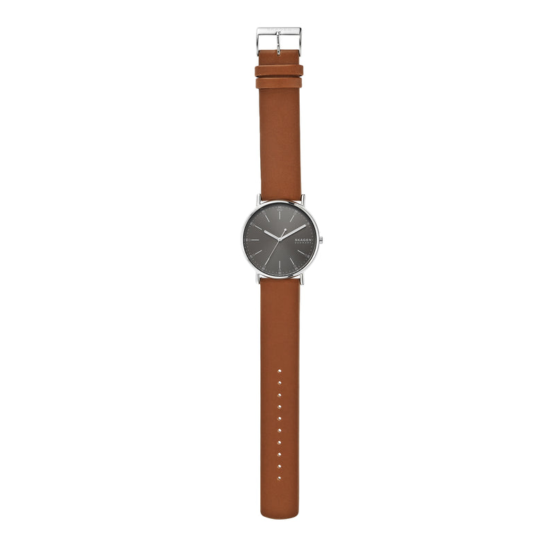 Wristwatch with a brown leather strap and dark gray circular face.