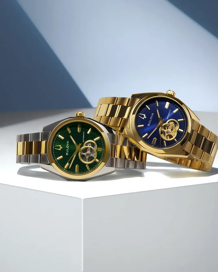 Bulova Surveyor 98A338 automatic men's watch with green open-heart dial and two-tone stainless steel bracelet — strap detail