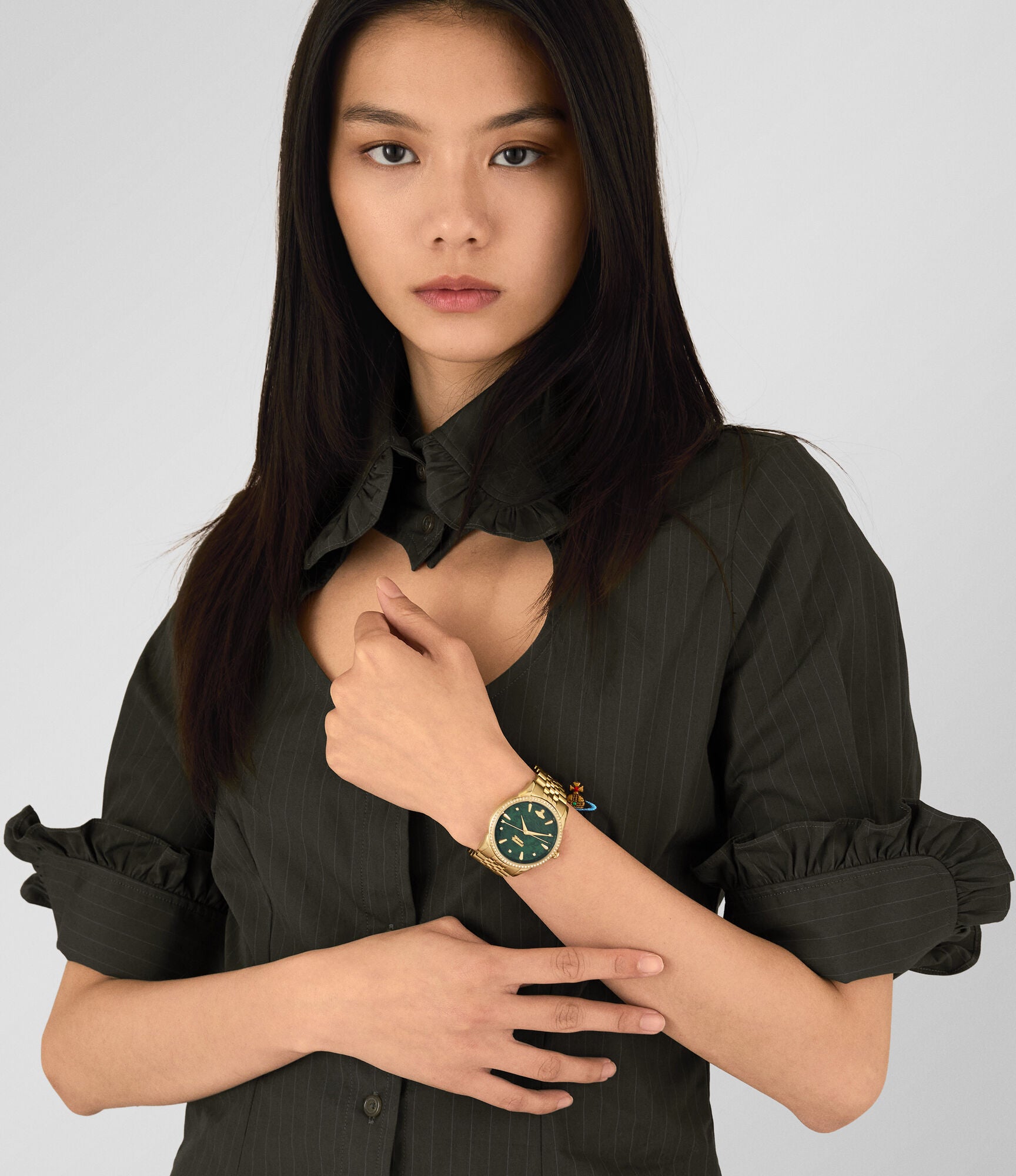 Vivienne Westwood Wallace women's watch with a gold dial and gold stainless steel bracelet. Shown at an angle.