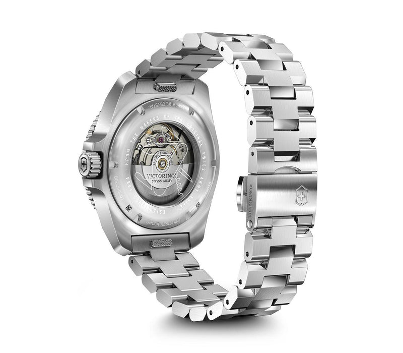 Silver wristwatch with a visible mechanical movement through the transparent case back.