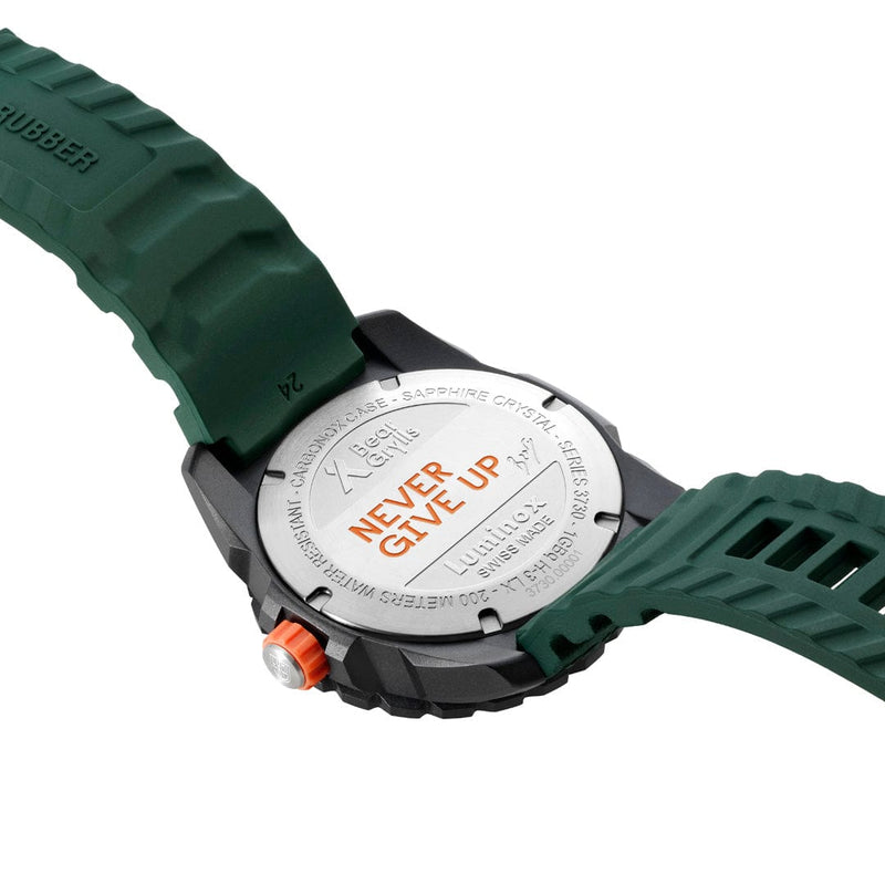 Wristwatch with a green rubber strap and silver-colored face.