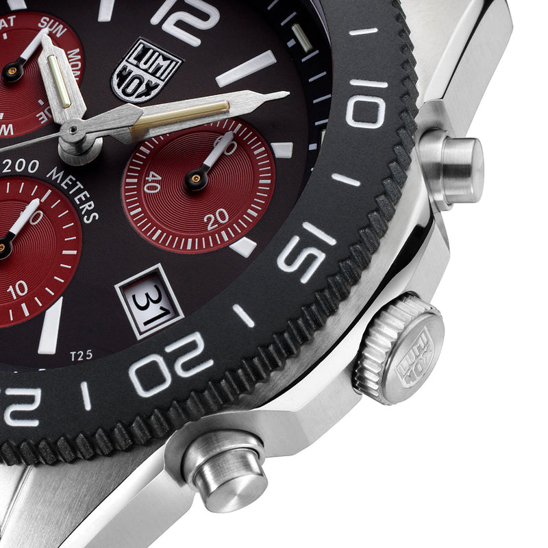 Luxury chronograph wristwatch with a black dial and red subdials.