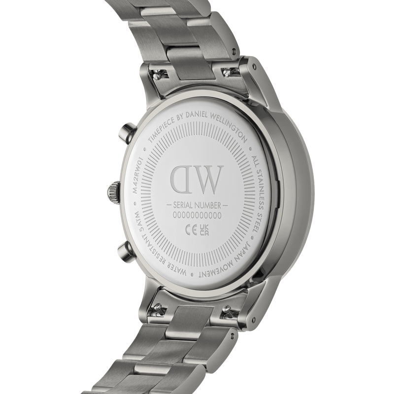 Back of a stainless steel wristwatch with ’DW’ engraved on its case.