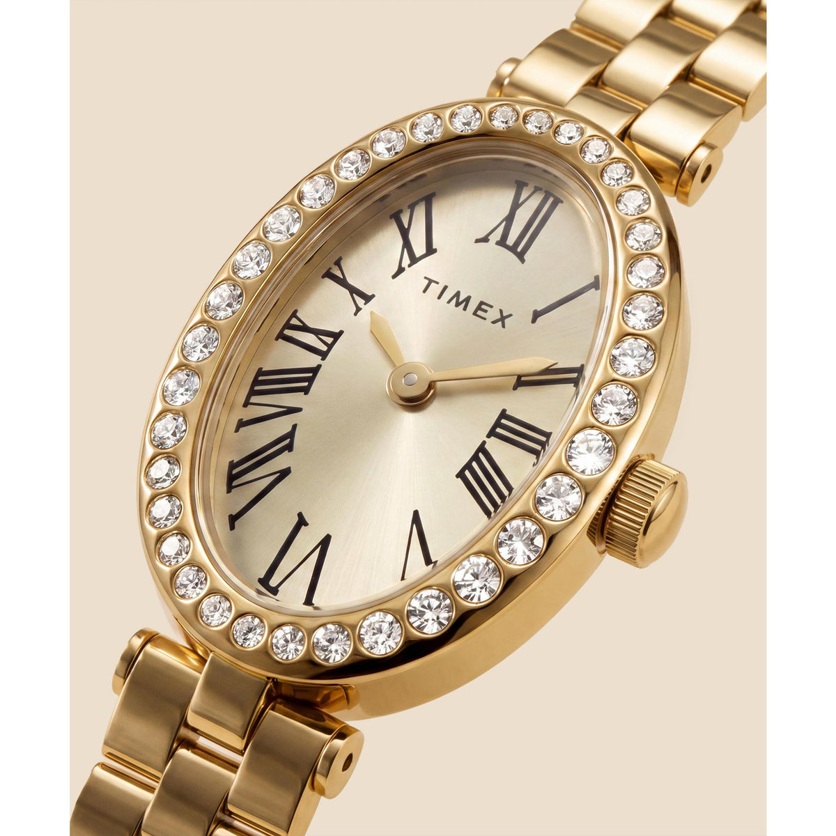 Timex Cavatina TW2Y90100 champagne dial with crystal-set bezel on a gold-tone bracelet, dial close-up