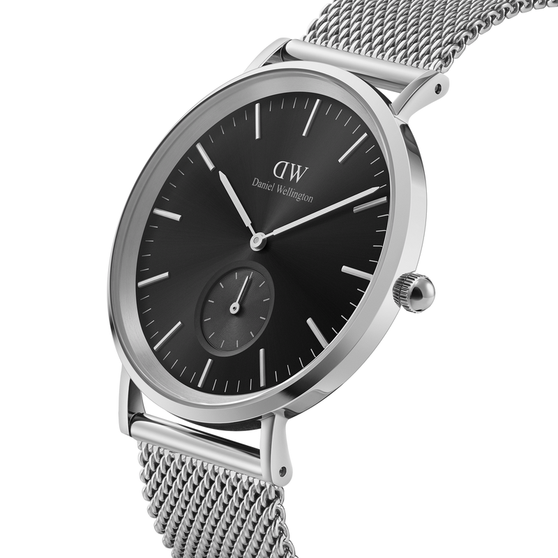 Sleek silver wristwatch with a black dial and mesh metal band.