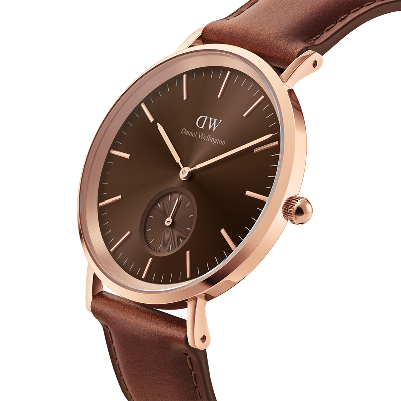 Elegant wristwatch with a brown leather strap and rose gold-toned case.