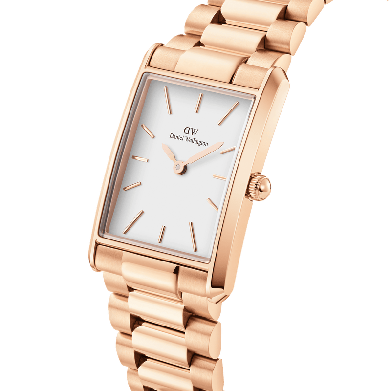 Rose gold rectangular wristwatch with a white face and metal link bracelet.