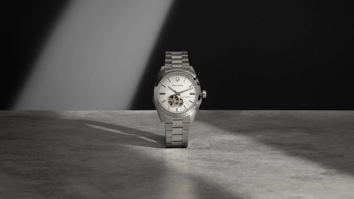 Bulova Surveyor 96A345 automatic men's watch with white dial and silver-tone stainless steel bracelet — lifestyle view