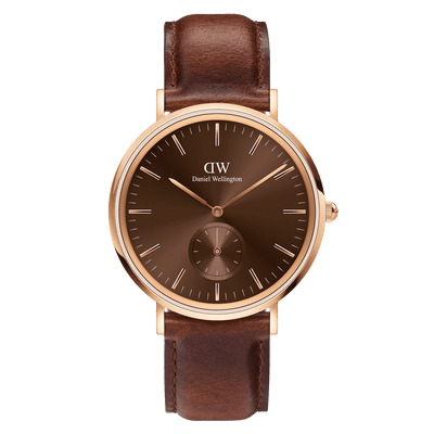 Elegant wristwatch with a brown leather strap and rose gold-toned case.