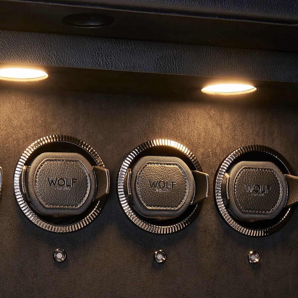 WOLF Athos 12 Piece Watch Winder Safe in Black, close-up of the lit watch winder modules