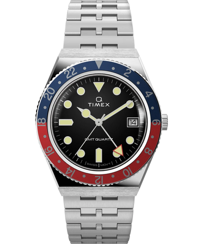 Timex wristwatch with a blue and red bezel, black dial, and stainless steel bracelet.