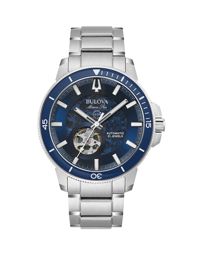 Stainless steel wristwatch with a blue dial and visible mechanical movement.