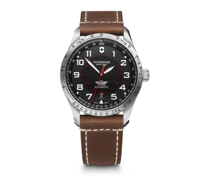 Wristwatch with a black dial, silver case, and brown leather strap.