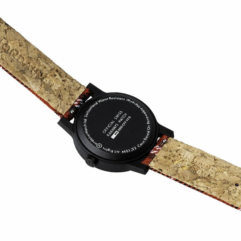 Wristwatch with a black face and a cork-textured strap.