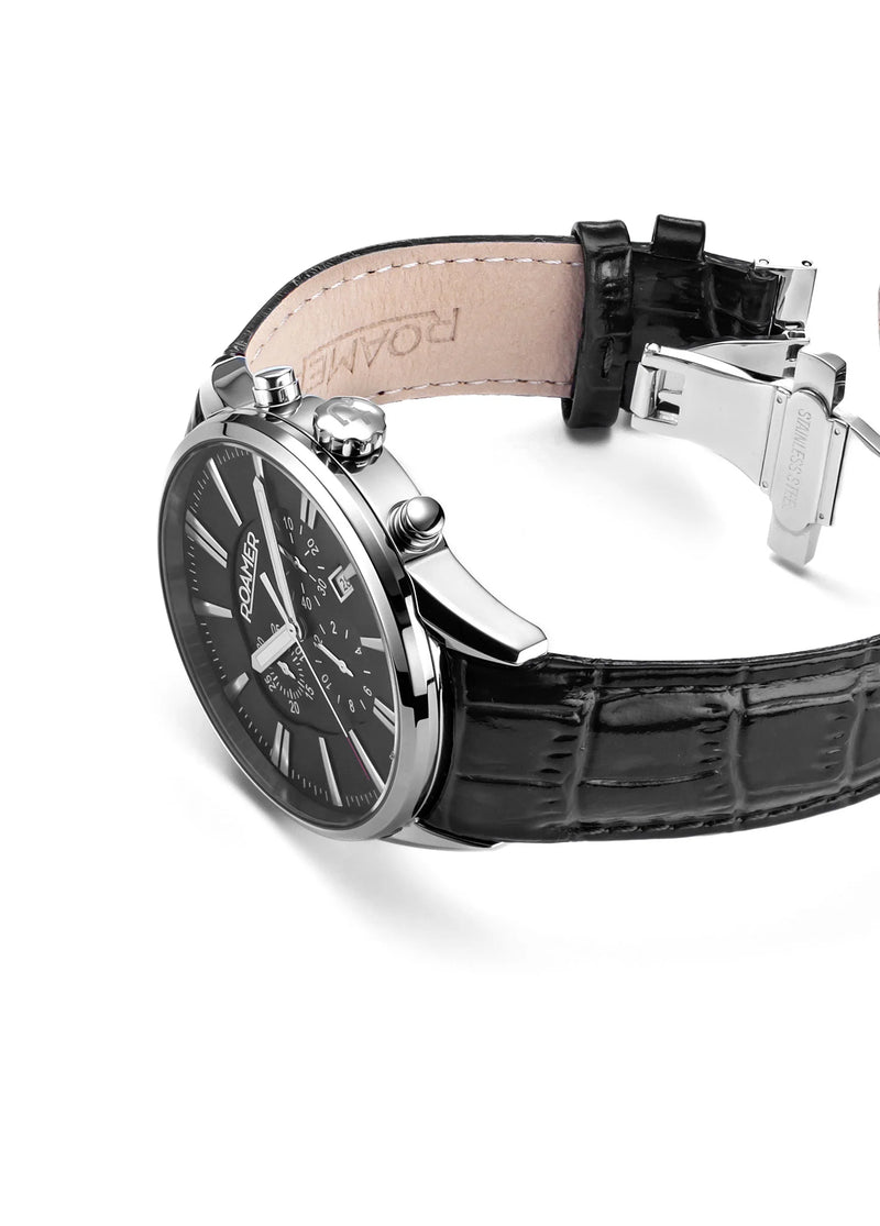 Elegant wristwatch with a black leather strap and silver-toned case.