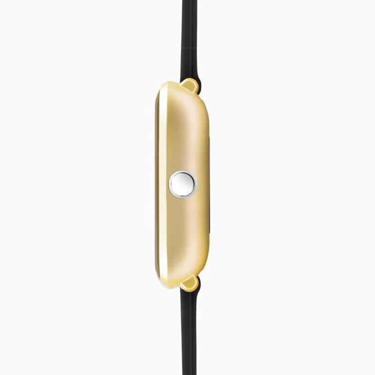 Gold-colored smartwatch or fitness tracker with a slim, rounded rectangular design and a central button.