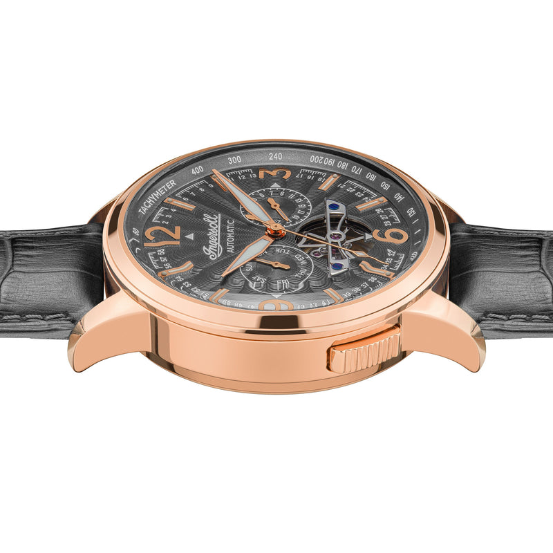 Luxury wristwatch with a rose gold case, black dial, and leather strap.