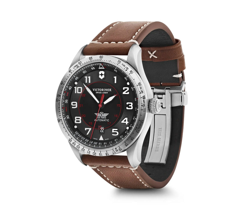 Stainless steel wristwatch with a brown leather strap and black dial face.