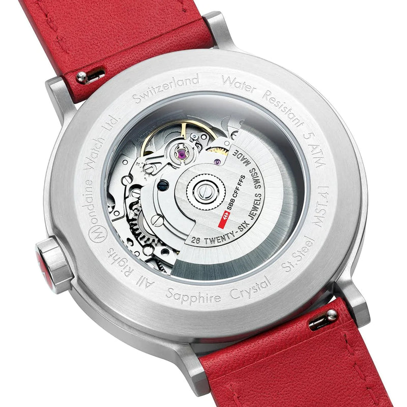 Back of a wristwatch with a transparent case showing the internal mechanism, attached to a red leather strap.