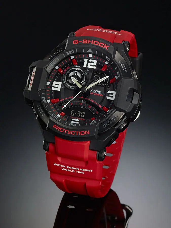 G-Shock watch with a black face and red strap.