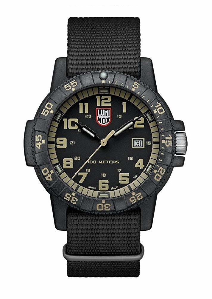 Rugged military-style wristwatch with a black fabric strap and luminous dial markings.