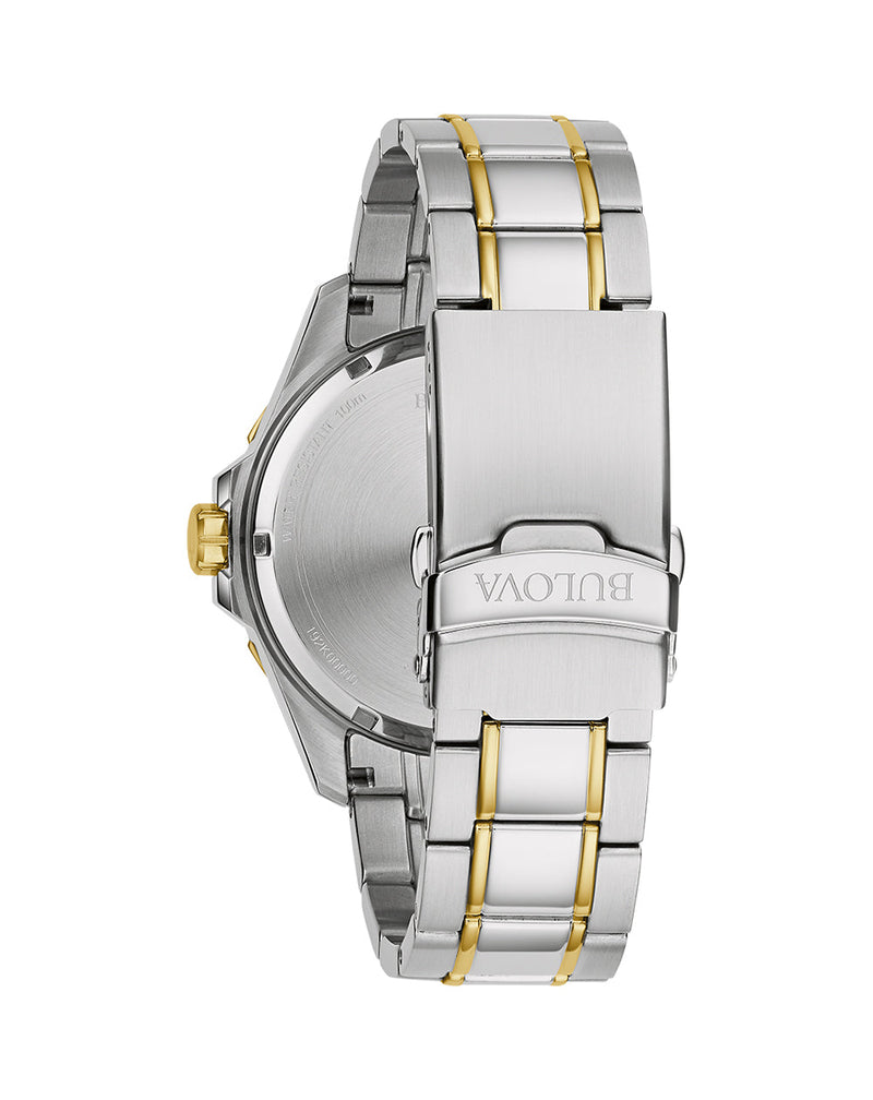 Two-tone metal wristwatch band with a clasp bearing the brand name ’Vaotm’.